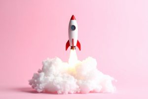 White rocket with red fins launching upward from a fluffy white cloud against a pastel pink background, signaling a takeoff or launch event.
