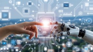 Human hand and robotic hand touch fingertips with a bright glow at the point of contact, symbolizing human-robot collaboration.