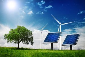 Sunlit rural landscape with solar panels and wind turbines beside a lone tree, representing renewable energy.