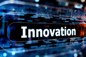 “Innovation” displayed on a high‑tech blue background with digital glow and network patterns.